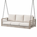 Altalena in legno con cuscini beige per esterni
