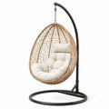 Sedia sospesa in rattan con cuscino beige e struttura in metallo nero Ø100 cm